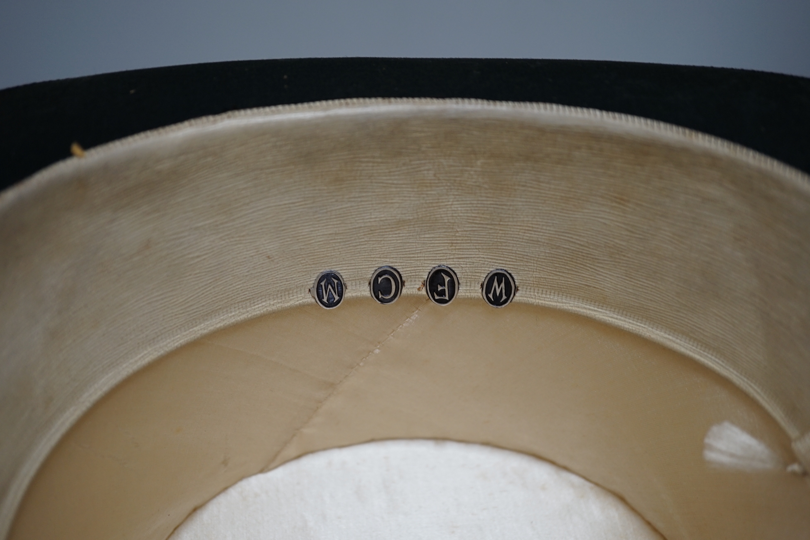 A black silk Dunn and Co top hat (boxed) and a black bowler hat by the same retailer (boxed)